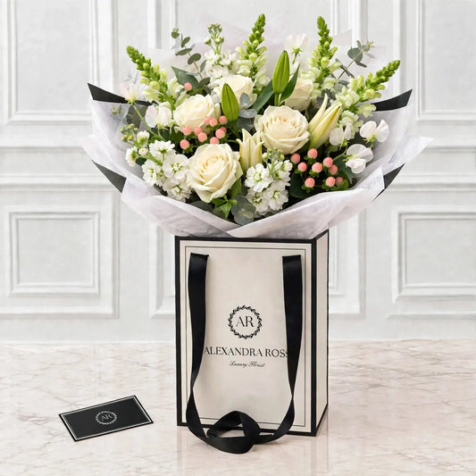 Beau all-white bouquet — Avalanche roses, Oriental lilies, phlox and snapdragons.