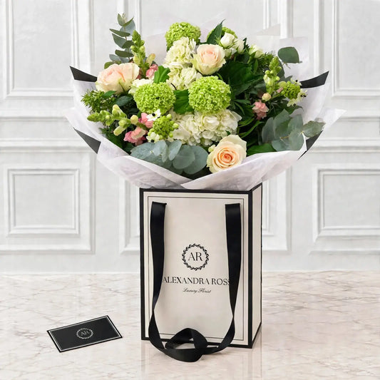 Belle luxury bouquet — pastel pink and apple green with Sweet Avalanche roses, snapdragons and chincherinchees.