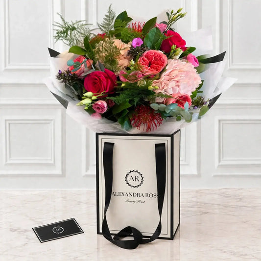 Harriet luxury bouquet — pink cushion protea, garden roses, lisianthus, phlox and hydrangea
