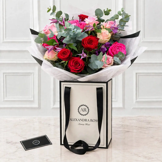 Sofia romantic bouquet — trio of premium roses with seasonal foliage